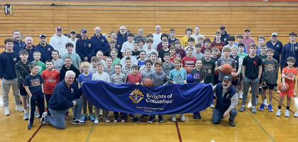 Members of Father Perez Council 1444 in Chicago gather with children ages 9-14 who participated in the council’s annual Free Throw Championship at Brother Rice High School.