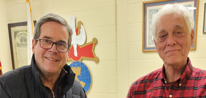 Neel Vanwinkle (left) and Steve Peyton from Bluegrass Council 762 in Lexington, Ky display some of the clothing donated during the council’s annual coat drive, a tradition for over 25 years.