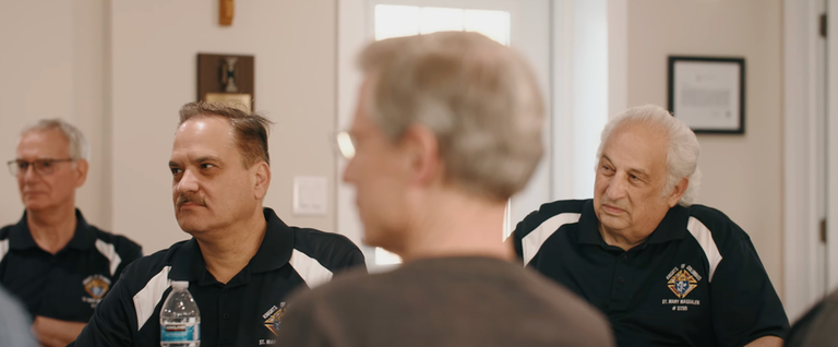 Knights gathered during a meeting for Cor.