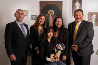 Grand Knight Steven Martinez (right) and David Libertella (left) of St. Timothy Council 12834 share a moment with staff and clients at the Life Center of Santa Ana. (Photo by Slav Zatoka)