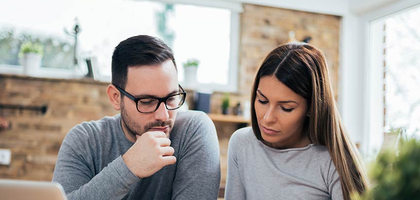 A man and woman reviewing insurance benefits.