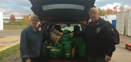 Past State Deputy Charles Lirette of Louis Hebert Council 6468 in Moncton, New Brunswick, and his wife, Aurella, deliver more than 450 pounds of groceries and $200 in cash donations, collected during the council’s Thanksgiving food drive, to the Food Depot Alimentaire in Moncton. 