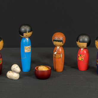 Photo of a painted wood Nativity scene featuring the Holy Family, 5 adults, and a sheep. Every person except the Christ Child is depicted in a kimono. 