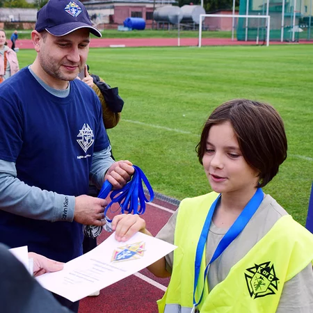 An athlete getting a medal for their win in the competition. 