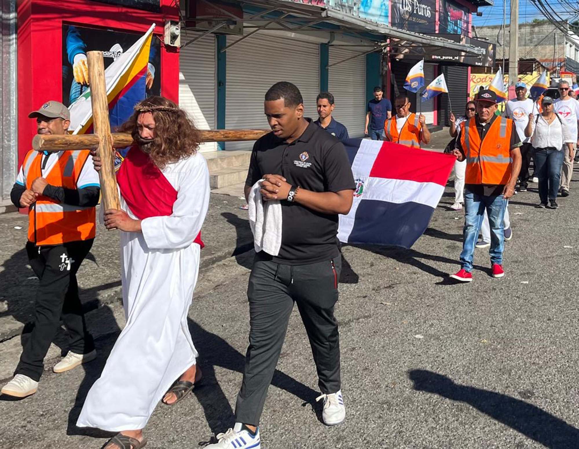 Knights and community members participate in a Via Crucis procession through the streets of Santo Domingo on Good Friday. 