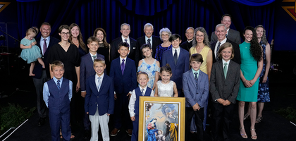 Ken and Mary Ann Duppong (back row, center) of Glen Ullin, North Dakota — joined by their children, children’s spouses and grandchildren — stand with Supreme Knight Patrick Kelly, his wife, Vanessa, and Supreme Chaplain Archbishop William Lori after being recognized as the 2025 International Family of the Year. (Photo by Paul Haring)