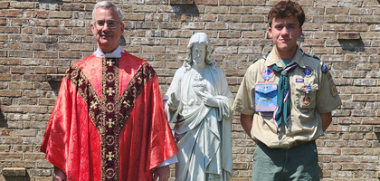 Father Frederick Edlefsen, pastor of Our Lady of Lourdes Church and chaplain of St. Joseph the Worker Council 14516 in Arlington, Va., stands with parishioner Jimmy Mazel beside a new statue of the Sacred Heart of Jesus installed in the parish prayer garden. Mazel coordinated the project for his Eagle Scout rank. Council 14516 contributed $2,500 of the $3,000 cost, and Knights volunteered 30 hours toward the project’s completion. The statue and garden were blessed and dedicated by Father Edlefsen.