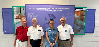 Grand Knight Jerry Lagarde (right) and members of Our Lady of Divine Providence Council 9347 in Metairie, La., stand with Karen Butler, community outreach director at Woman’s New Life Clinic, after delivering more than $800 in cash donations and over $1,200 worth of baby supplies collected during a parish drive. Council 9347 has supported the clinic for the past five years.