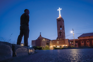 Alex McKenna stands outside Sts. Peter and Paul the Apostles Church in Erbil, Iraq