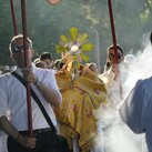 Father Peter Martyr Yungwirth carries the monstrance 