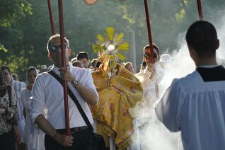 Father Peter Martyr Yungwirth carries the monstrance 