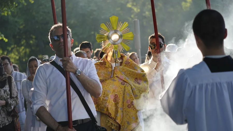 Father Peter Martyr Yungwirth carries the monstrance 