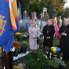 Supreme Chaplain Archbishop William Lori of Baltimore and Archbishop Mieczysław Mokrzycki of Lviv pray at the grave of a fallen soldier at Mars Field in Lviv.