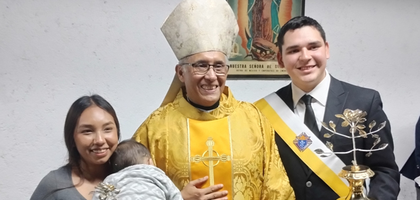 Joel Aguirre of Santa Filomena Council 16296 in Monterrey, Mexico Northeast, and his wife, Rubí (holding their baby Mateo), display Knights of Columbus Silver Roses with Auxiliary Bishop Juan Armando Pérez Talamantes, vicar general for the Archdiocese of Monterrey.