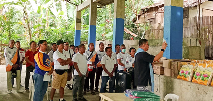Father Dirk Sanchez, pastor of Nuestra Señora del Rosario Parish in Magallanes, Mindanao, blesses food packages prepared by his brother Knights in Magallanes Council 7885 for distribution to families in need. 