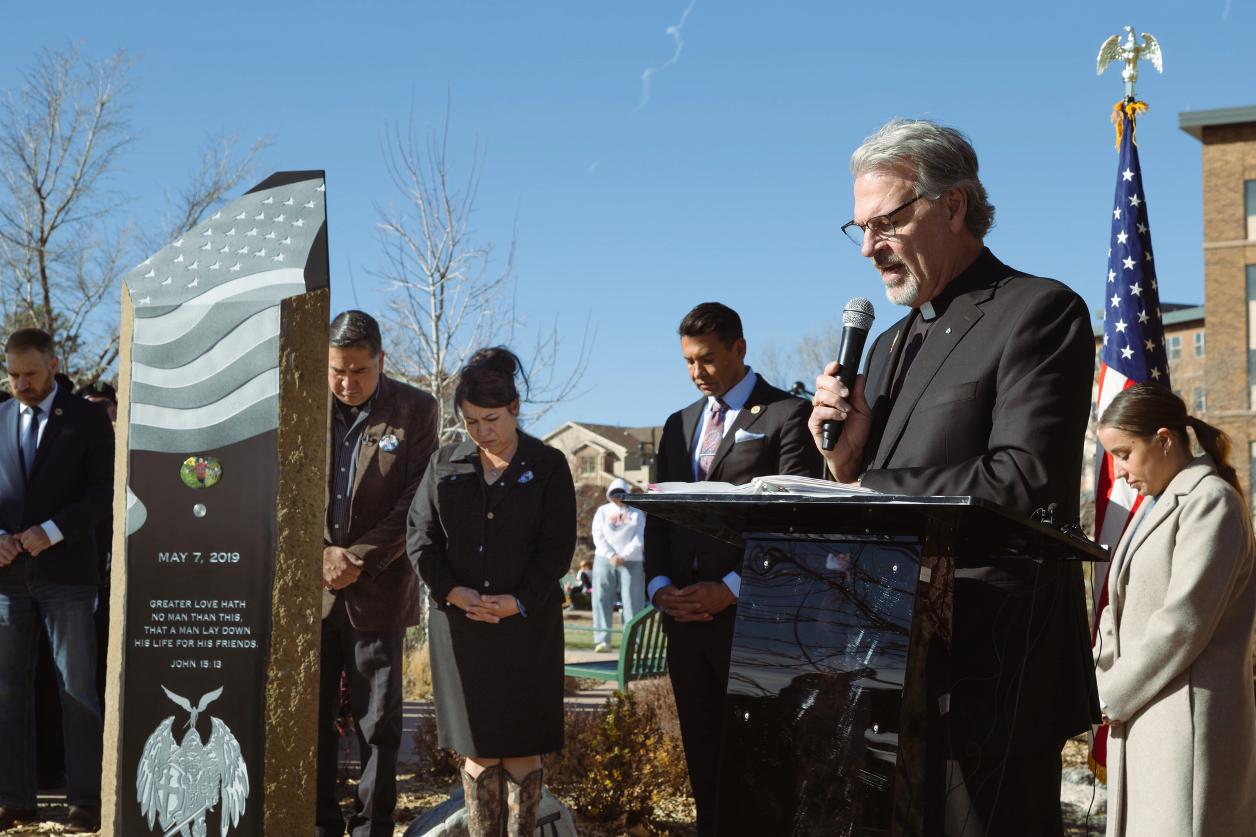 Father Gregory Bierbaum, pastor of St. Mark Parish in Highlands Ranch, Colo., and chaplain of St. Mark Highlands Ranch Council 1498, prays during the unveiling. (Photo by Neil McDonough / Denver Catholic)