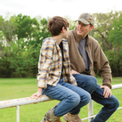 A father and son share a conversation.