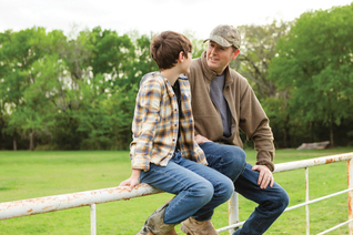 A father and son share a conversation.