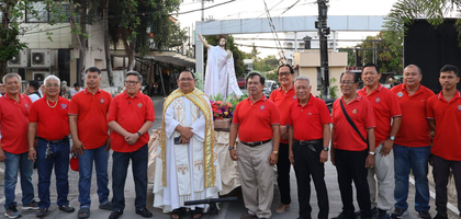 Members of Our Lady of Montserrat Council 10101 in Iloilo City, Visayas, gather with Father Angelo Colada, pastor of Our Lady of Montserrat Parish and a brother Knight, before leading Salubong, a traditional Easter procession in the Philippines. 