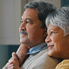 A retired couple looks into the light.