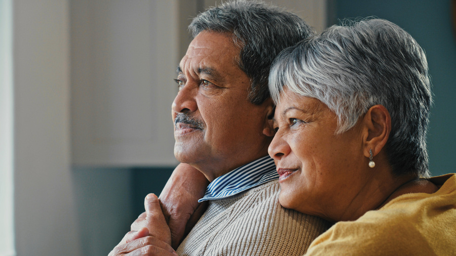 A retired couple looks into the light.