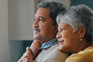 A retired couple looks into the light.