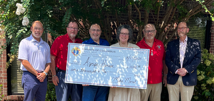 Grand Knight Joseph Morel (second from left) and other Knights from Father E.F. Callahan Council 3837 in Union City, Tenn., present a $1,000 check — proceeds from fish fry fundraisers — to Kelly Morgan, director of Agape House of Northwest Tennessee, a pregnancy resource center. The council also donated $1,000 to Isaiah House in Trenton, a foster care home.