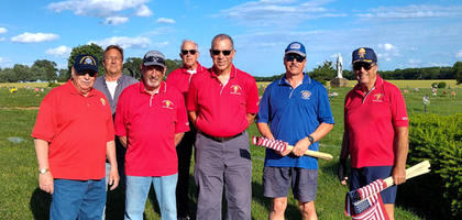 Members of Father George P. Boehmicke Assembly 2753 in Hopkinsville, Ky., gather at Green Hills Memorial Cemetery to add nearly 900 U.S. flags — replacing about 850 old ones — to the graves of local veterans. 