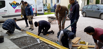 Knights from Marshal Foch Council 18411 in Tarbes prepare to pour concrete for a new walkway at Tarbes Cathedral. 