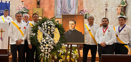 K of C leaders from Mexico South, including several grand knights, assemble near an image of Blessed Michael McGivney displayed at the rectory chapel at Nuestra Señora de Guadalupe Parish in Mérida after praying a rosary in honor of Father McGivney on his feast day, Aug. 13. The Mexico South State Council worked with councils in Mérida to organize the feast day event, which included a votive Mass celebrated by state chaplain Father Jorge Martínez Ruz. Among the leaders in attendance were Supreme Director Jorge Estrada (second from left), Deputy Supreme Master Rommel Palma (third from right), and Mexico South State Deputy René Sansores (second from right).