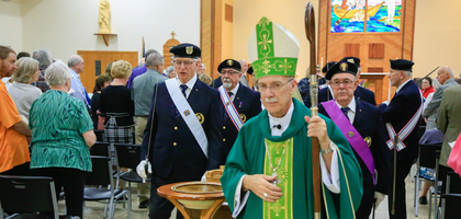 A Fourth Degree honor guard processes behind Bishop Luis Zarama of Raleigh following Mass at St. Peter the Fisherman Church in Oriental, N.C. Father Kenneth I. Parker Assembly 1820 in New Bern, N.C.