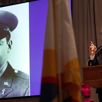 Supreme Master Michael McCusker, the leader of the Fourth Degree, shares a lesson on the service and sacrifice of military chaplains during the Exemplification of Patriotism ceremony Feb. 22. (Photo by Gregory Shemitz)