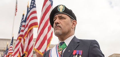 Fourth degree members standing with American flags.