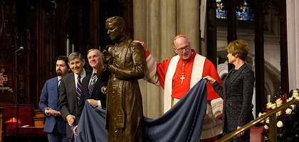 Cardinal Timothy Dolan, archbishop of New York, Supreme Knight Patrick Kelly (third from left), and relatives of Blessed Michael McGivney.