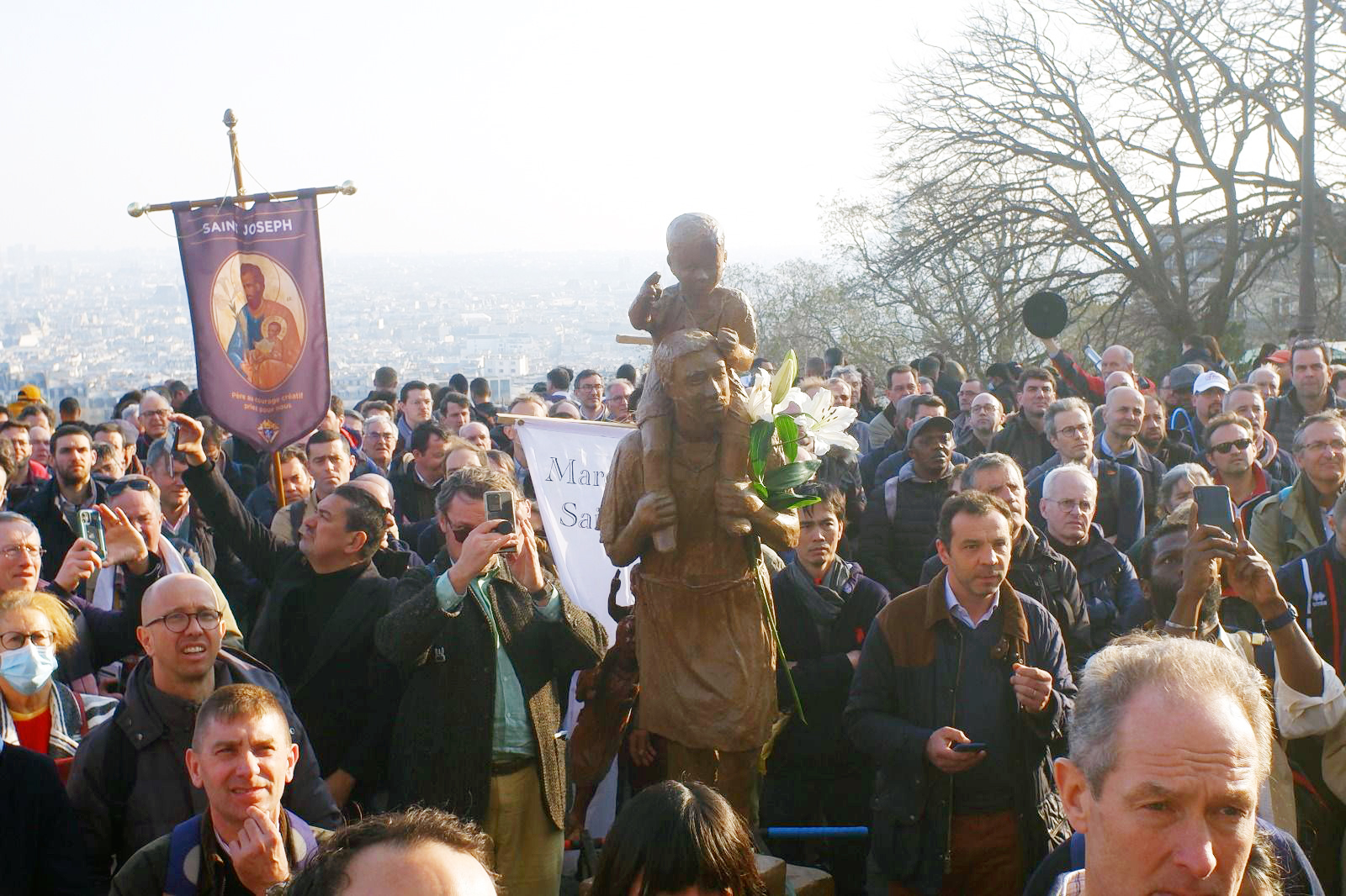 French Knights and other participants in the March of St. Joseph in Paris process through the city.