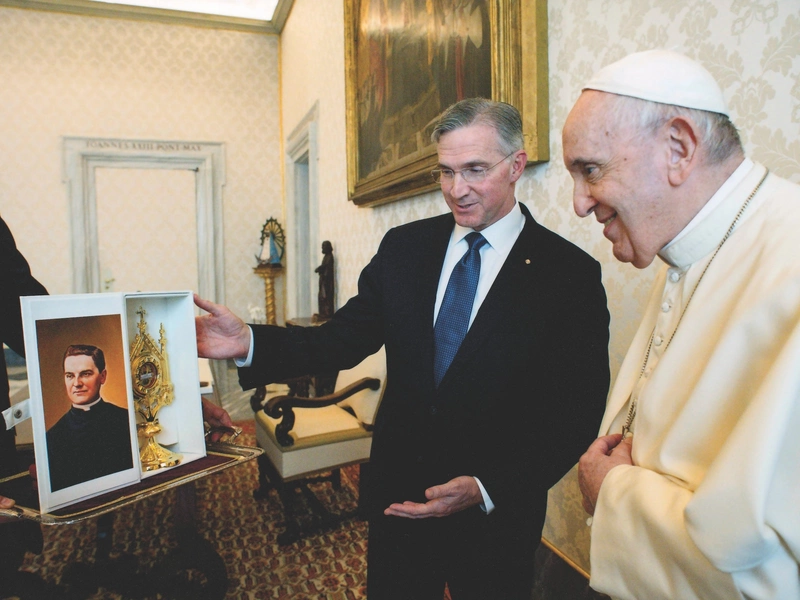 Supreme Knight Patrick Kelly presents Pope Francis with a first-class relic of Blessed Michael McGivney.
