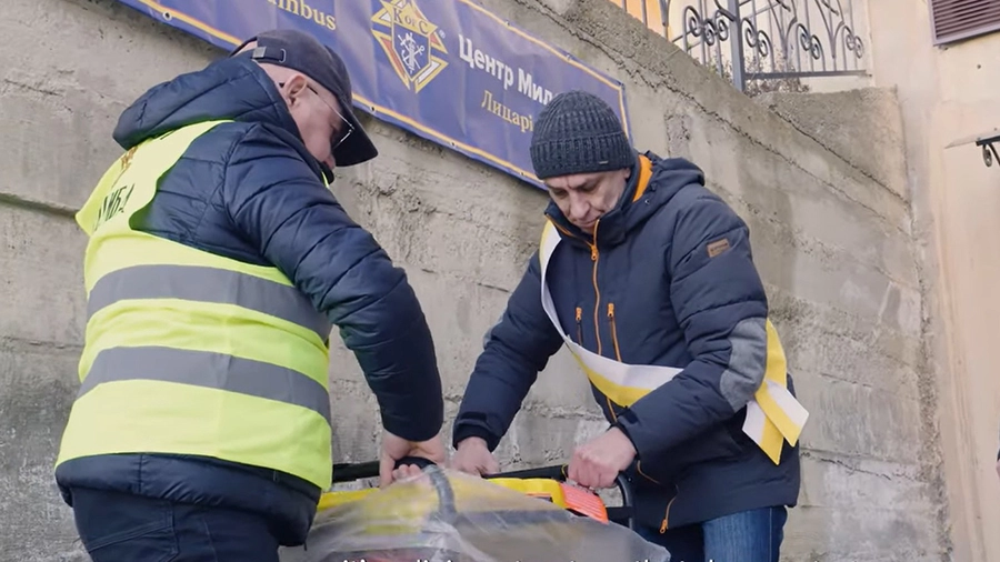 Knights unpack a generator during a delivery at a parish in Ivano-Frankivsk, Ukraine.