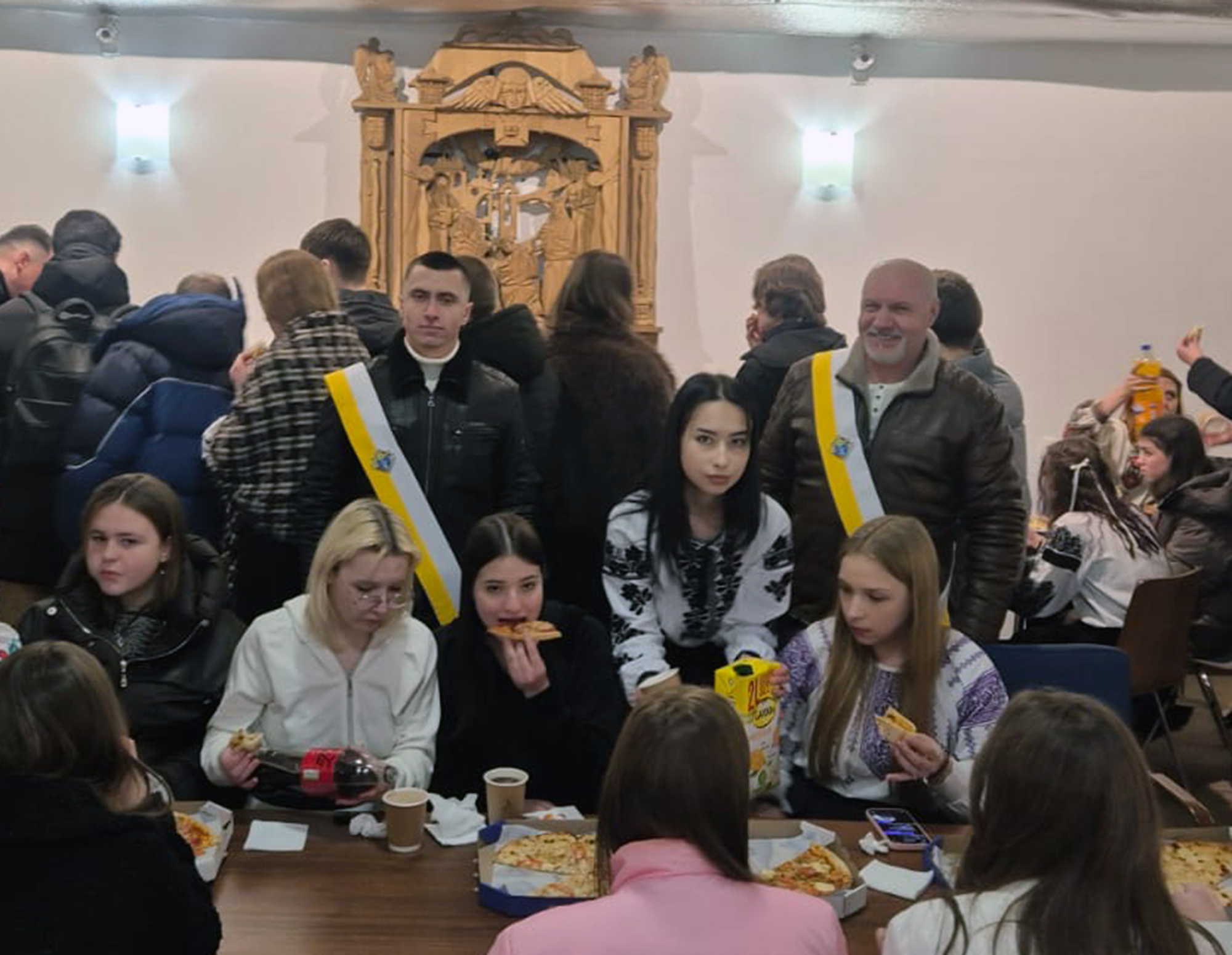 Knights serve dinner to people in need at the Patriarchal Cathedral of the Resurrection of Christ in Kyiv, Ukraine.