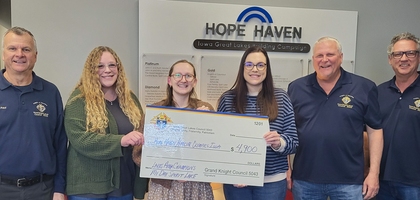Grand Knight Jed Skogerboe (second from right) and other members of Iowa Great Lakes Council 5043 in Spirit Lake, Iowa, present a donation of nearly $5,000 — half of the proceeds from its annual charity golf tournament — to representatives of Hope Haven, an organization that helps people with disabilities develop work and life skills.