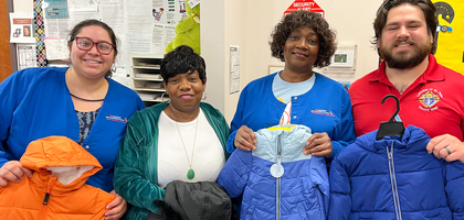 Grand Knight Johnny Reitano of The Cathedral of St. Peter Council 15746 in Belleville, Ill., presents coats to staff at Belleville Head Start Center, which serves children ages 3-5 from low-income families. The council donated more than 50 coats purchased through the Coats for Kids program and local stores.