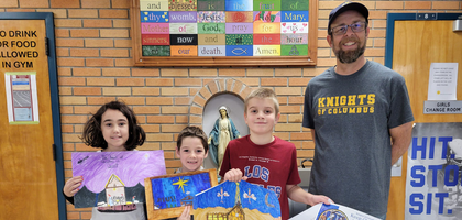 Grand Knight Will Huys of Father John McMaster Council 6495 in West Lorne, Ontario, stands with the winners of the council’s Keep Christ in Christmas poster contest. Nearly 50 students from three grades participated.