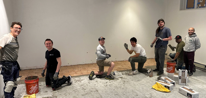 Utah State Deputy Frank Carmona (second from right) and members of Father Thomas D. Kraft, O.P. Council 14764 in Salt Lake City lay hundreds of floor tiles for a new meeting space at the St. Catherine of Sienna Newman Center.