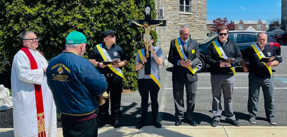 Members of Father Thomas J.F. Ryan Council 5036 in Philadelphia lead an outdoor Stations of the Cross on Good Friday for about 60 parishioners at Resurrection of Our Lord Parish.