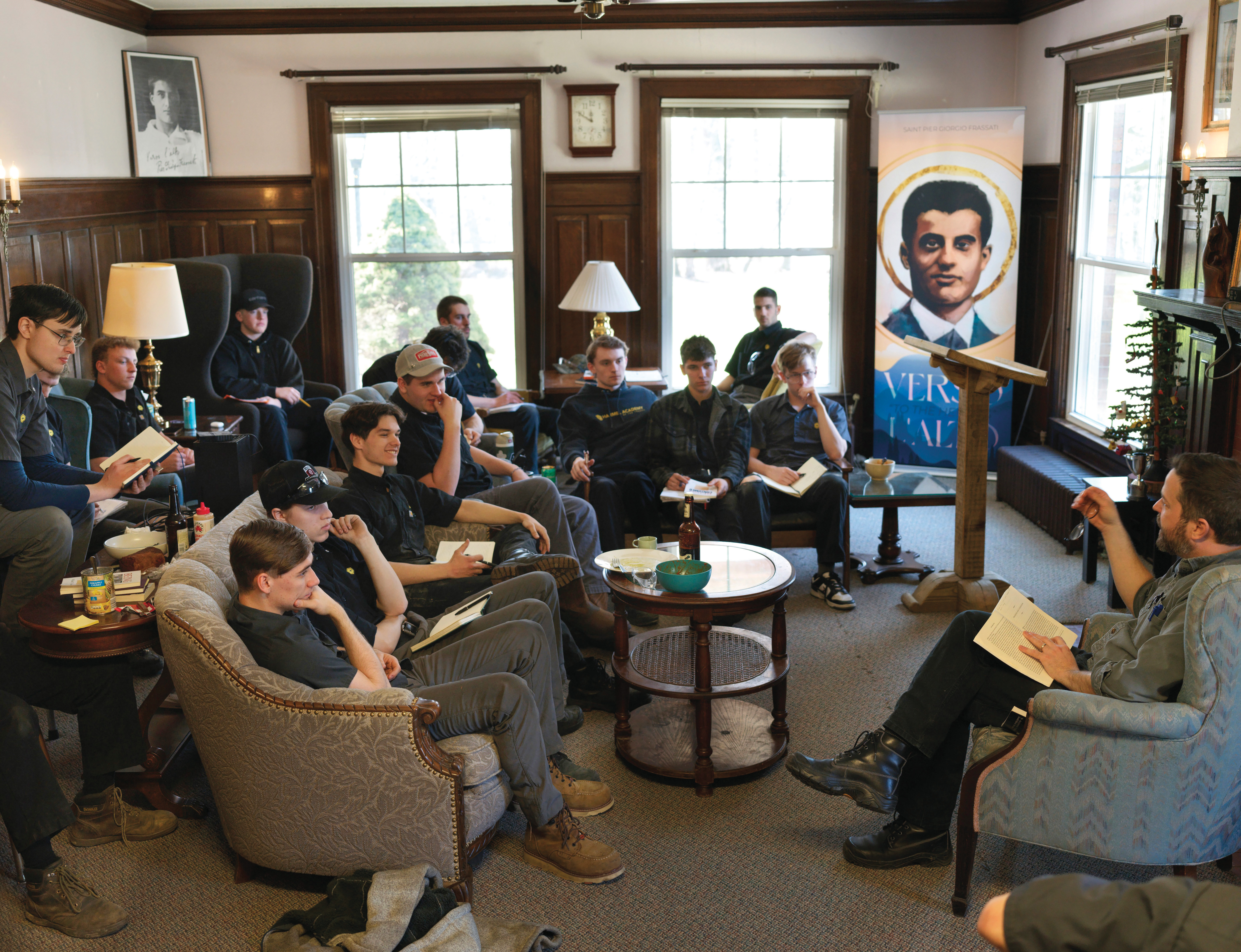 David Michael Phelps (right), president of Harmel Academy of the Trades, speaks with students in April.