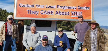Knights from Three Apostles Council 7752 in Buena Vista, Colo., assemble by a council-sponsored billboard installed at a parishioner’s ranch along Colorado Highway 285 promoting local pregnancy resource centers. Council 7752 raised nearly $3,000 to fund the project, and local businesses donated wood and fasteners that Knights used to construct the billboard. Since 2020, the council has raised more than $7,300 for Buena Vista Pregnancy Center and also supports Buena Vista’s annual walk for life.