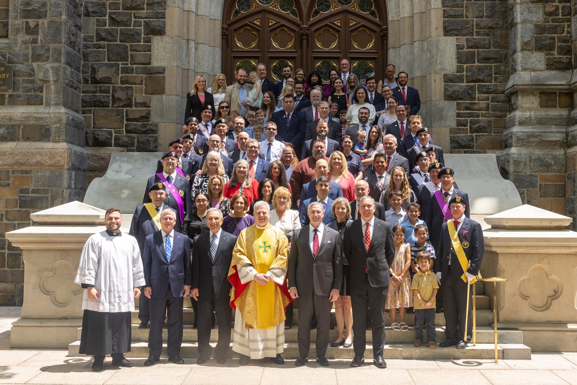 Supreme Officers, fraternal leaders, Supreme Council staff members, their families and Father Michael Dolan are pictured on the steps of St. Mary&rsquo;s Church.
