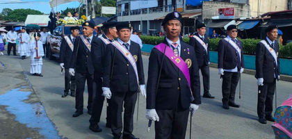 Members of St. Francis of Assisi Assembly 3602 in Dasmariñas City provide an honor guard for a Eucharistic procession from Kristong Hari Parish to San Agustin Parish to celebrate the feast of Christ the King.