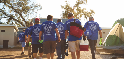 Florida Knights gather for a workday to construct tent platforms at a homeless shelter in Clearwater, Fla.