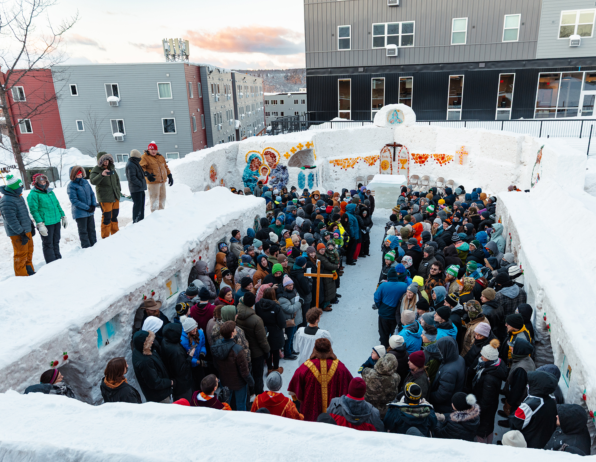 Worshippers pack the Ice Chapel of Our Lady of the Snows at Michigan Technological University for Mass