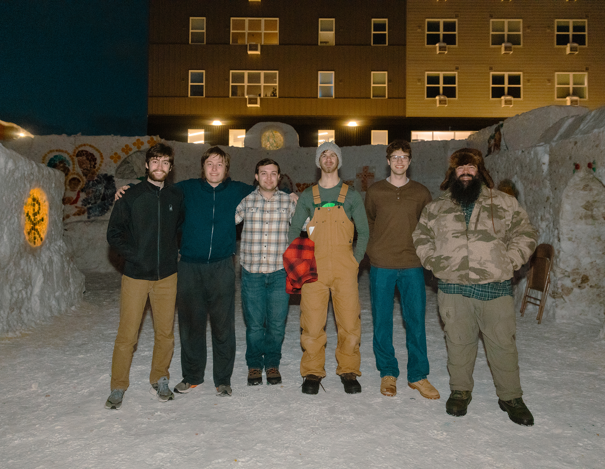 College Knights stand inside an ice chapel at Michigan Technological University.